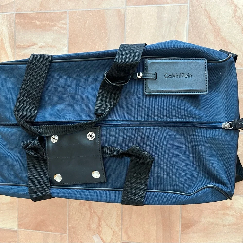 NWOT Calvin Klein Blue & Black Canvas Travel Duffel Bag with Wheels